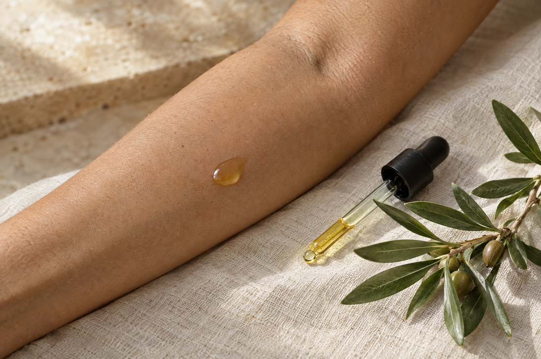 A drop of argan oil on the inner forearm for a patch test to check whether argan oil irritates skin